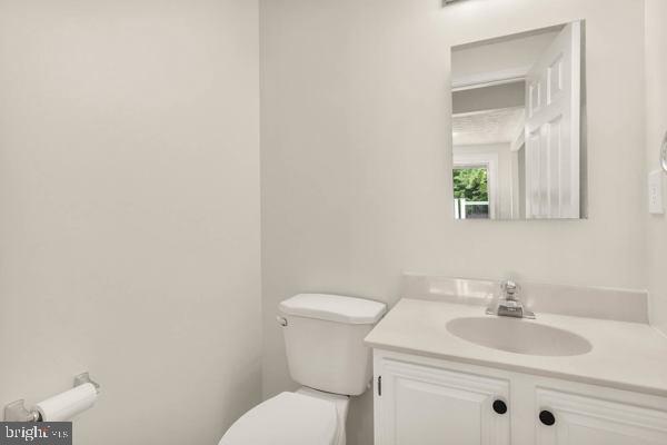 10640 Gorman Road Laurel, MD 20723 - Photo 10 of 25 a bathroom with a toilet sink and mirror