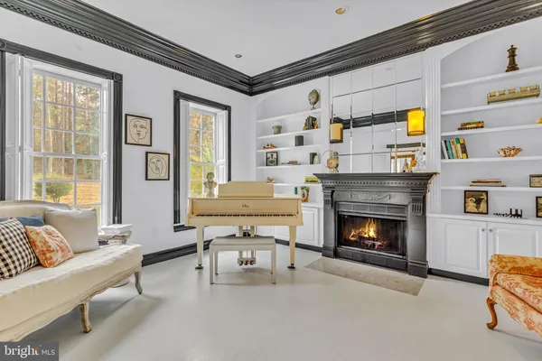 a view of a dining room with furniture and a chandelier