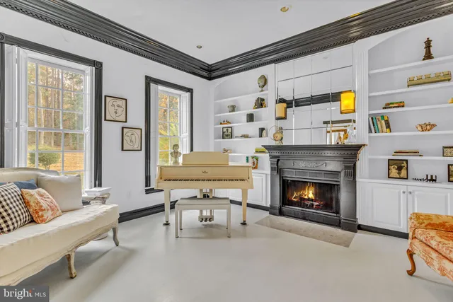 a view of a dining room with furniture and a chandelier