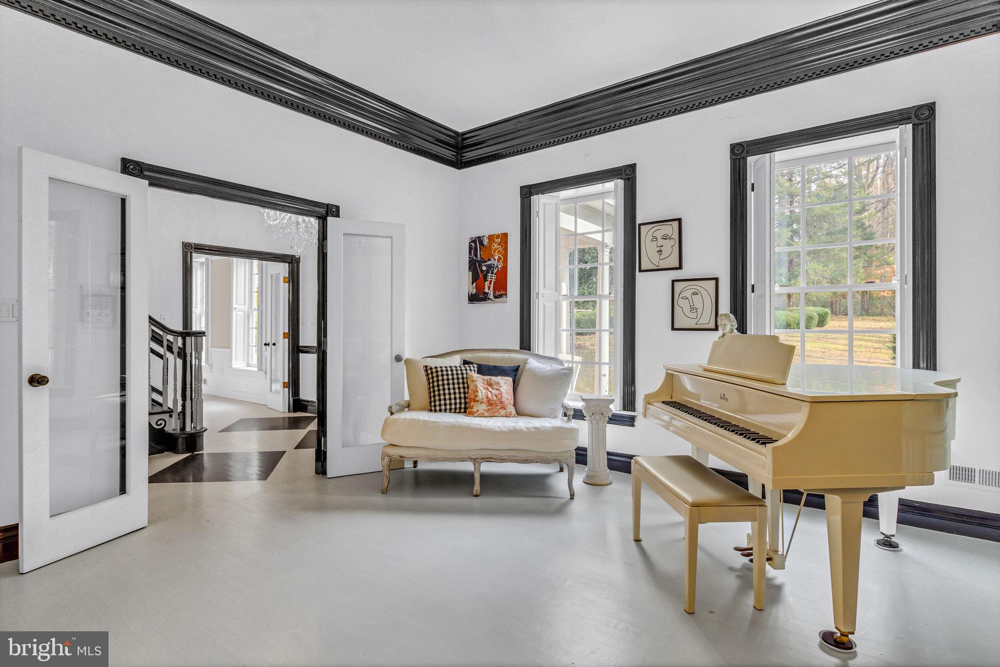 673 Nugent Road Weems, VA 22576 - Photo 12 of 72 a living room with furniture and a window