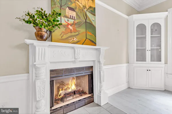 a dining area with furniture and a large window