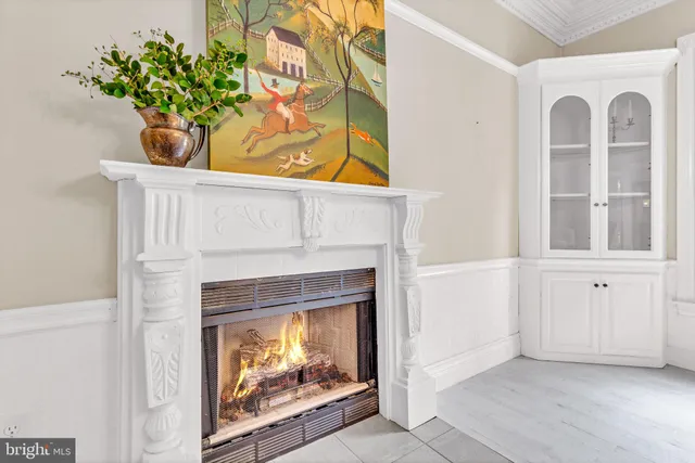 a dining area with furniture and a large window