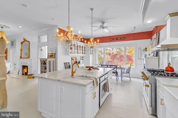 a living room with kitchen island furniture and a window