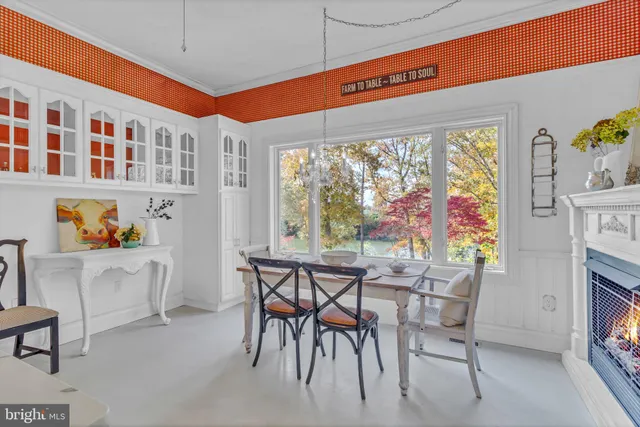 a bathroom with a tub and a window