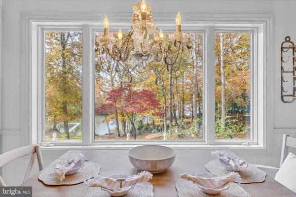 a bathroom with a granite countertop sink a toilet and bathtub