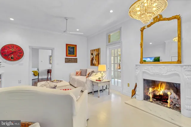 a bedroom with a bed and a large mirror