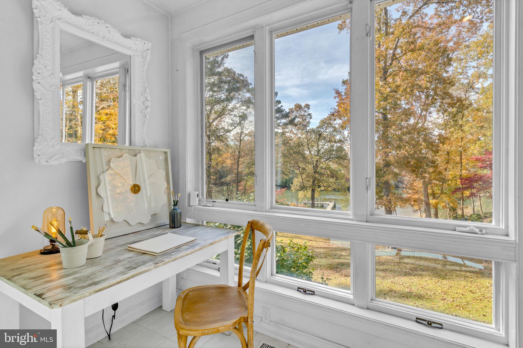673 Nugent Road Weems, VA 22576 - Photo 29 of 72 a view of a dining room with furniture window and outside view