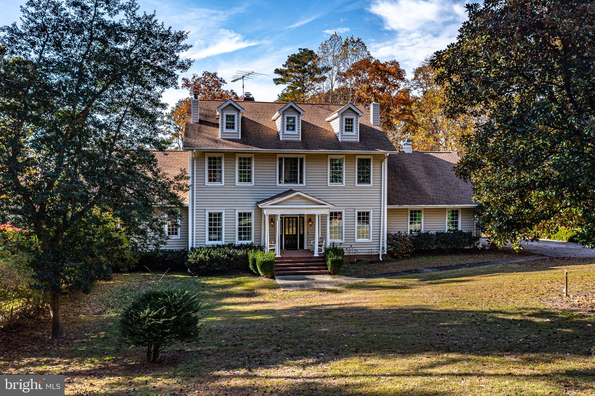 673 Nugent Road Weems, VA 22576 - Photo 3 of 72 a front view of a house with a yard