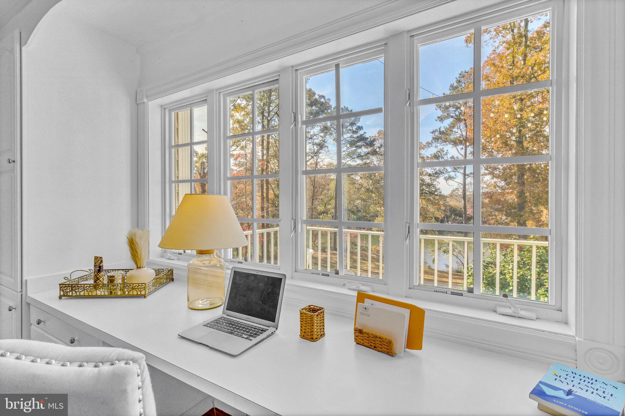 673 Nugent Road Weems, VA 22576 - Photo 31 of 72 a living room with kitchen island furniture and a window