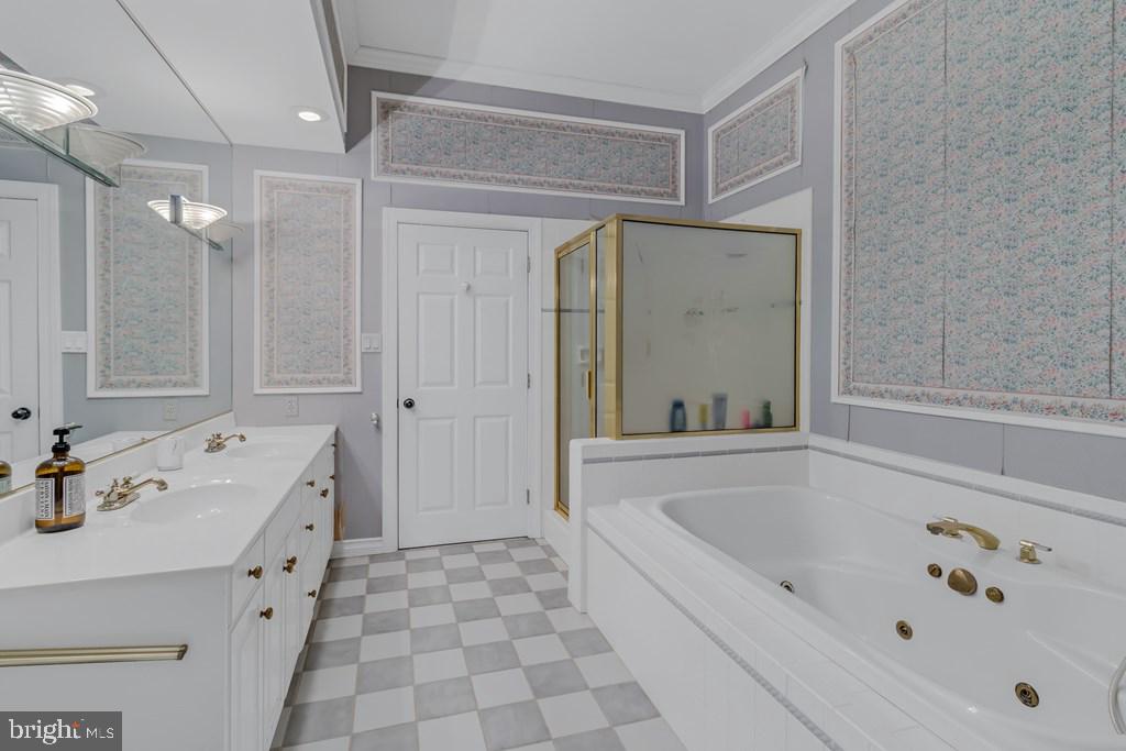 673 Nugent Road Weems, VA 22576 - Photo 42 of 72 a bathroom with a bathtub and a shower