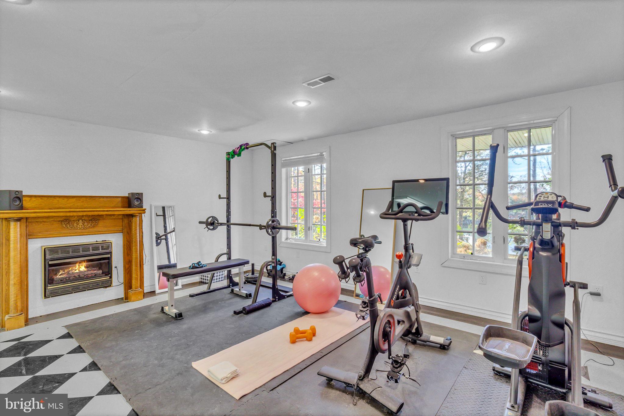 673 Nugent Road Weems, VA 22576 - Photo 52 of 72 a view of a room with gym equipment