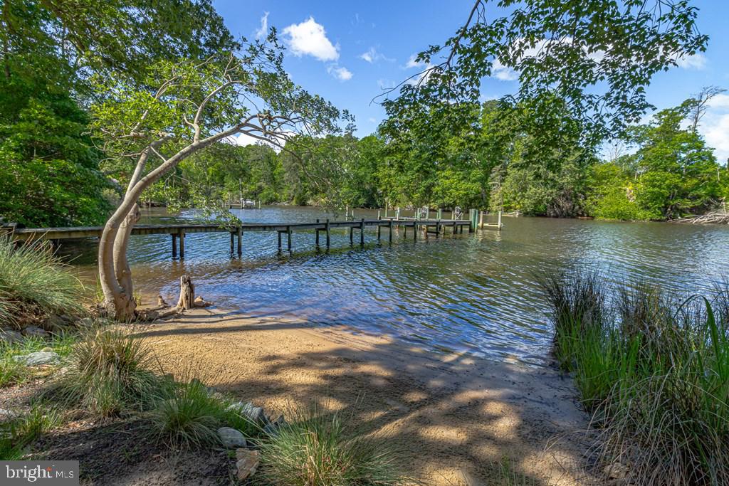 673 Nugent Road Weems, VA 22576 - Photo 59 of 72 a view of a lake with a tree