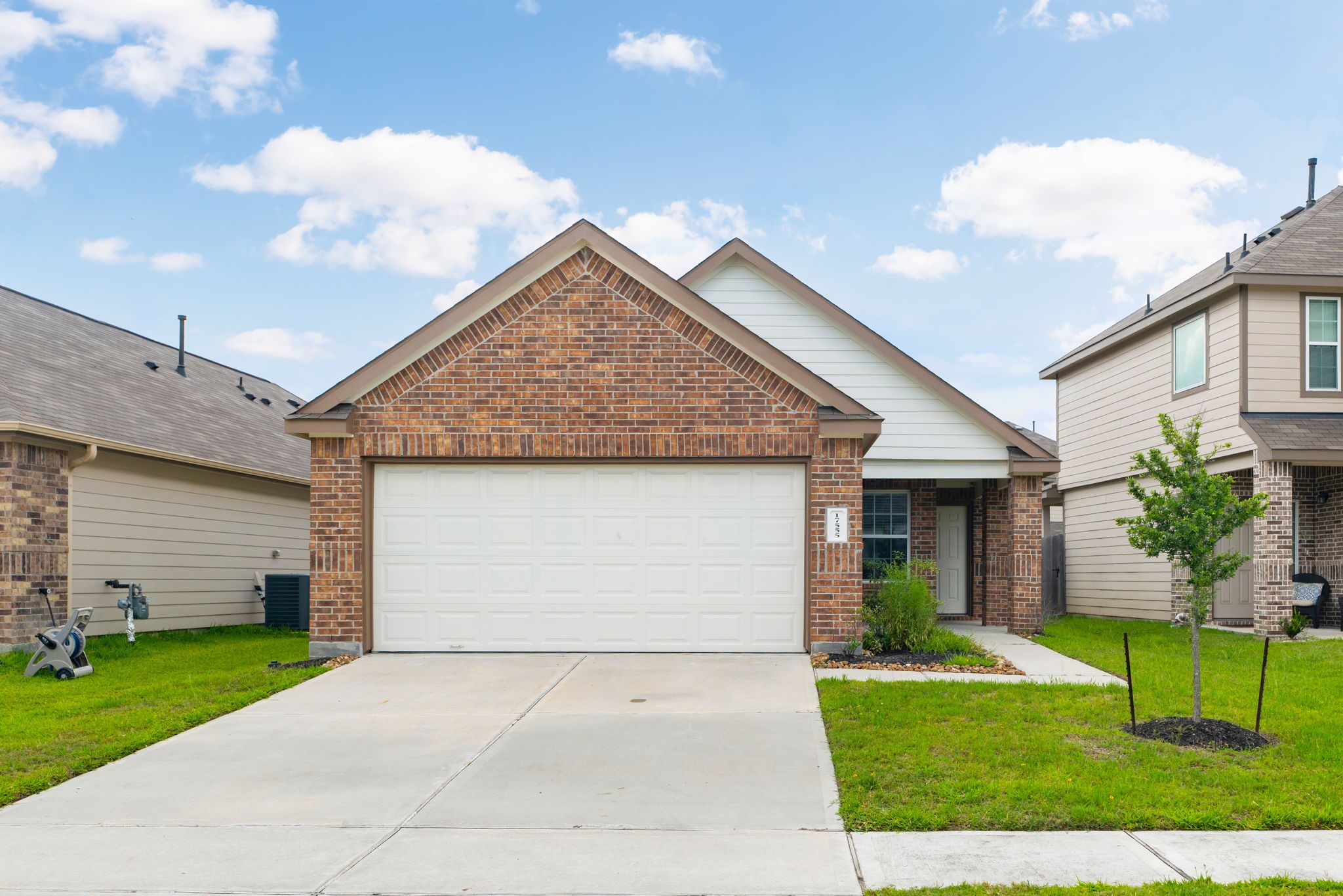 17555 Greystanes Road Humble, TX 77346 - Photo 1 of 28 a front view of house with a garden and pathway