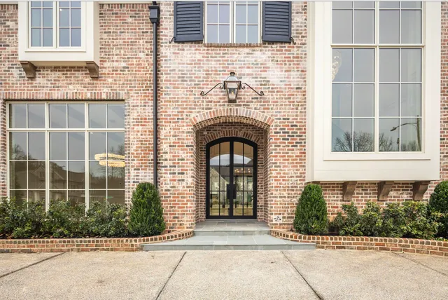 a view of empty room with wooden floor and fireplace