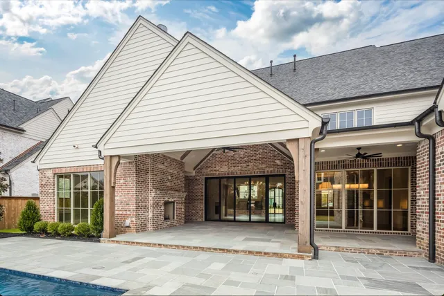 a view of a white house with a large windows