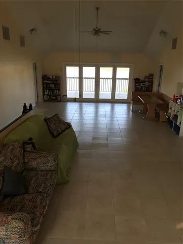 a bedroom with furniture and a flat tv screen
