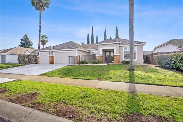 a front view of a house with a yard