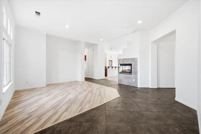 a view of a kitchen with a sink and a refrigerator