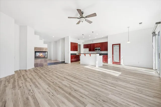 a view of a kitchen with a sink and a refrigerator