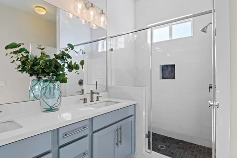 a bathroom with a sink a vanity and a mirror