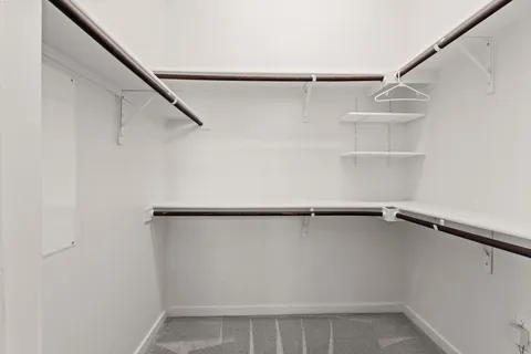 a view of an empty walk in closet