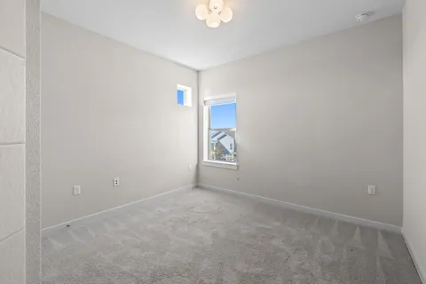 a view of an empty room and window