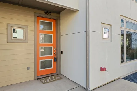 a view of an entryway with wooden floor and windows