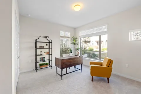 a view of a dining room with furniture window and outside view