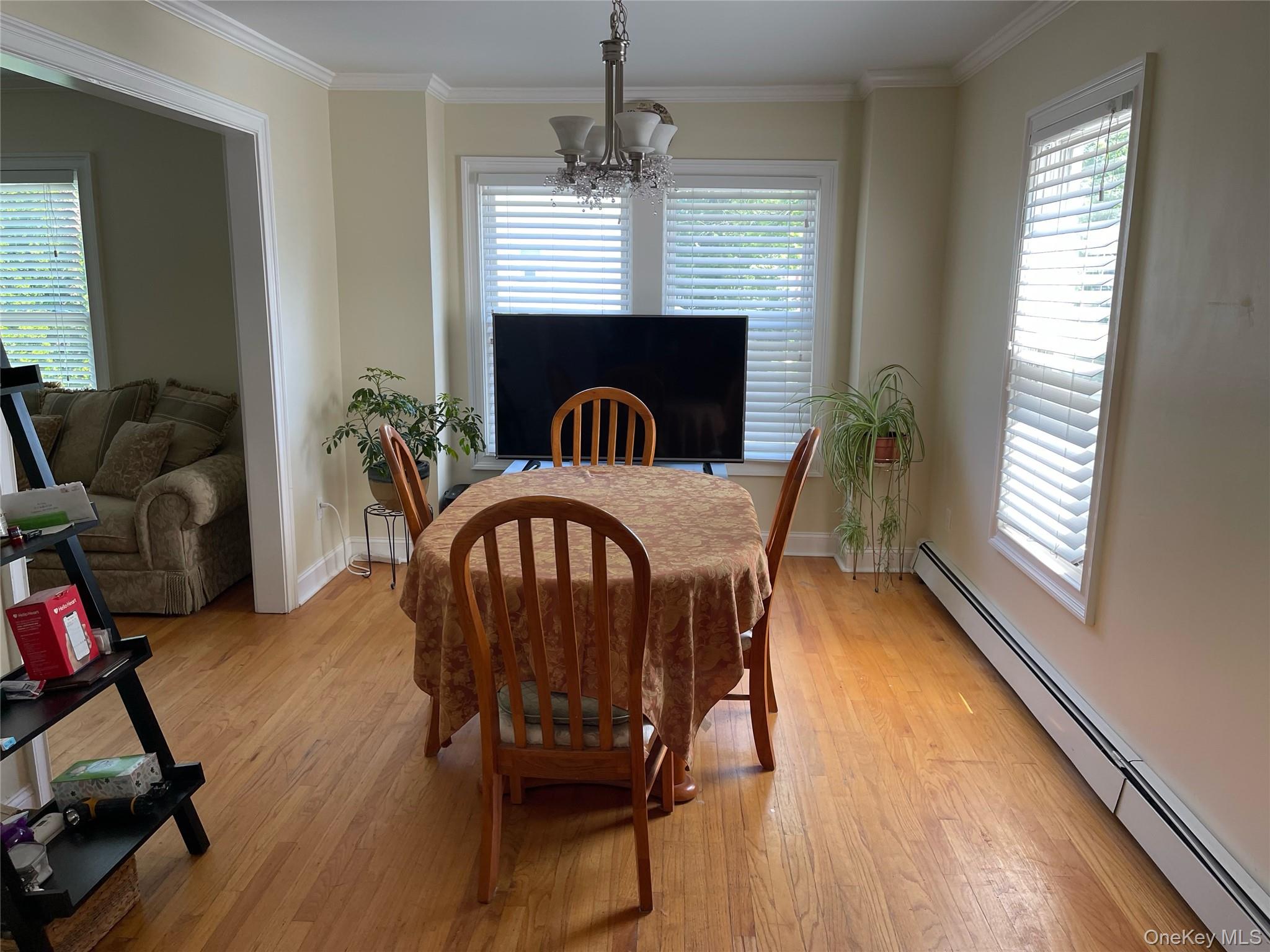 73 South Bedford Road Chappaqua, NY 10514 - Photo 11 of 30 a view of a dining room with furniture window and wooden floor