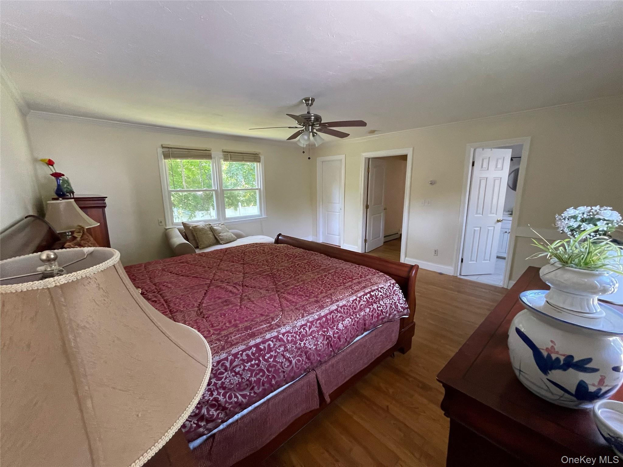 73 South Bedford Road Chappaqua, NY 10514 - Photo 17 of 30 a bedroom with a bed and a chandelier