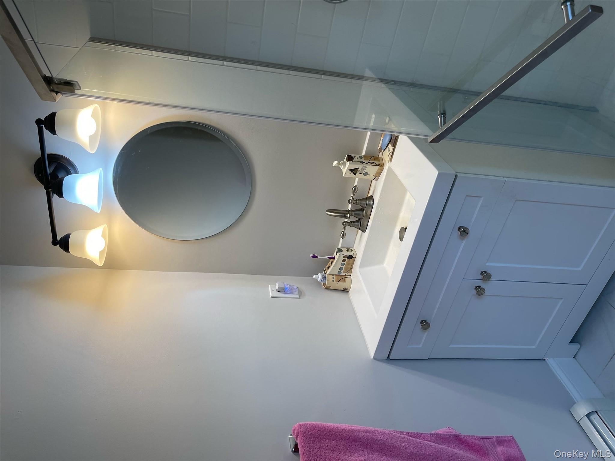 73 South Bedford Road Chappaqua, NY 10514 - Photo 20 of 30 a bathroom with a sink and a mirror