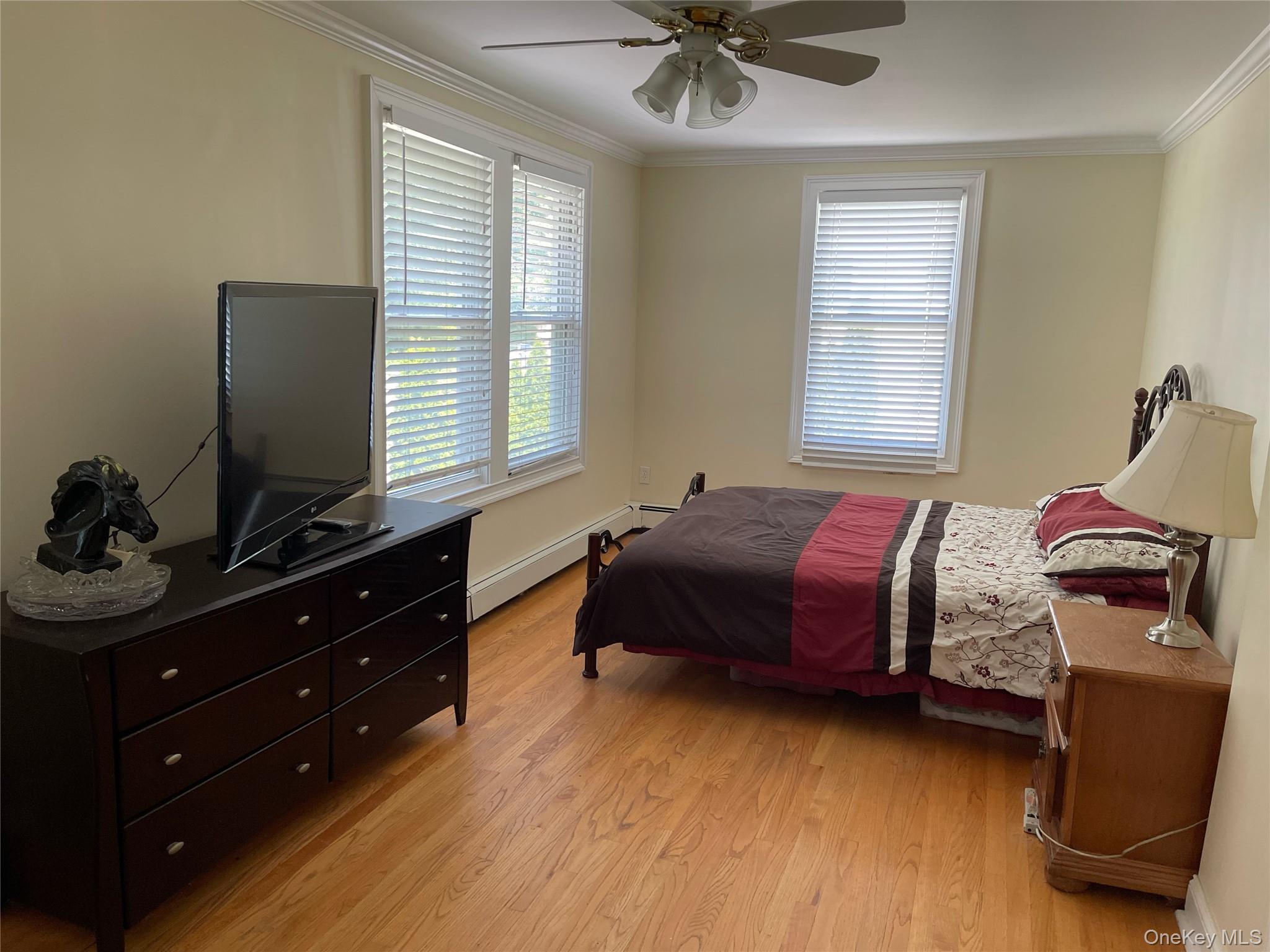 73 South Bedford Road Chappaqua, NY 10514 - Photo 23 of 30 a bedroom with a bed and wooden floor