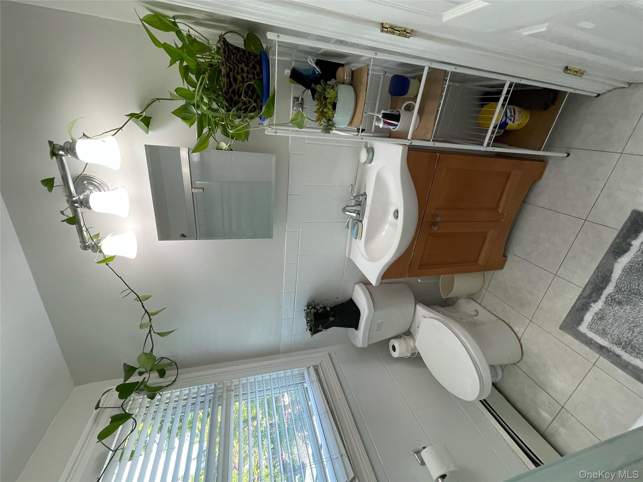 73 South Bedford Road Chappaqua, NY 10514 - Photo 28 of 30 a bathroom with a sink toilet and shower
