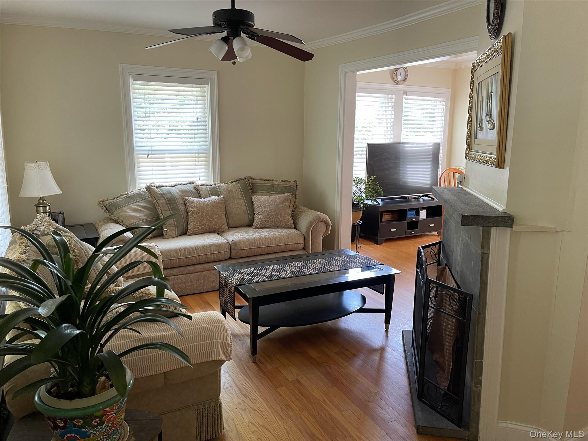 73 South Bedford Road Chappaqua, NY 10514 - Photo 8 of 30 a living room with furniture a window and a flat screen tv