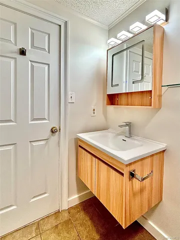 a bathroom with a sink a mirror and a shower