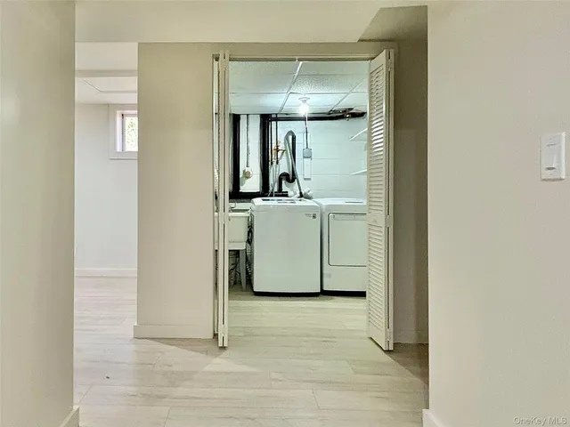 a view of a room with wooden floor and cabinet