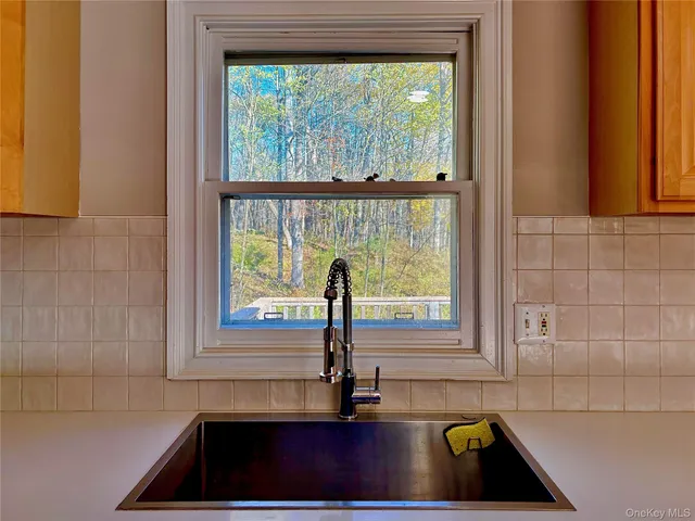 a kitchen with a sink and a window