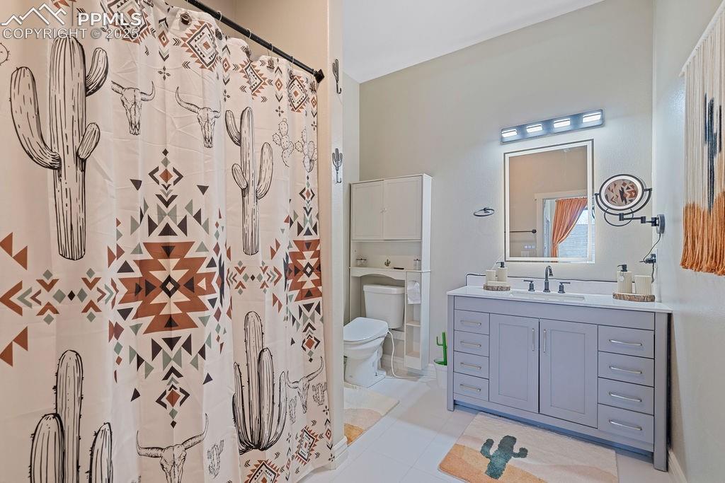 8450 Edison Road Yoder, CO 80864 - Photo 25 of 50 a spacious bathroom with a double vanity sink mirror and toilet