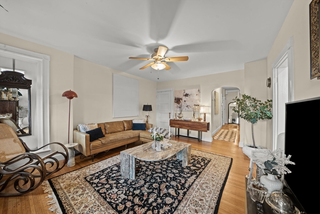 9 Regent Circle, Unit 3 Brookline, MA 02445 - Photo 2 of 20 a living room with furniture and a flat screen tv