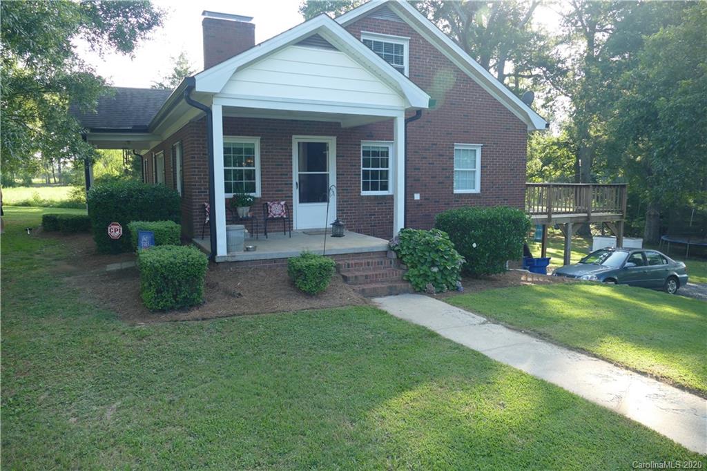 5901 Cress Road Concord, NC 28025 - Photo 3 of 27 a view of a house with backyard and garden