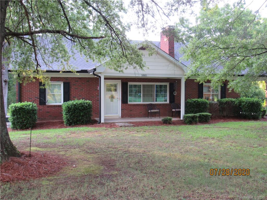 5901 Cress Road Concord, NC 28025 - Photo 4 of 27 a view of a house with backyard porch and garden