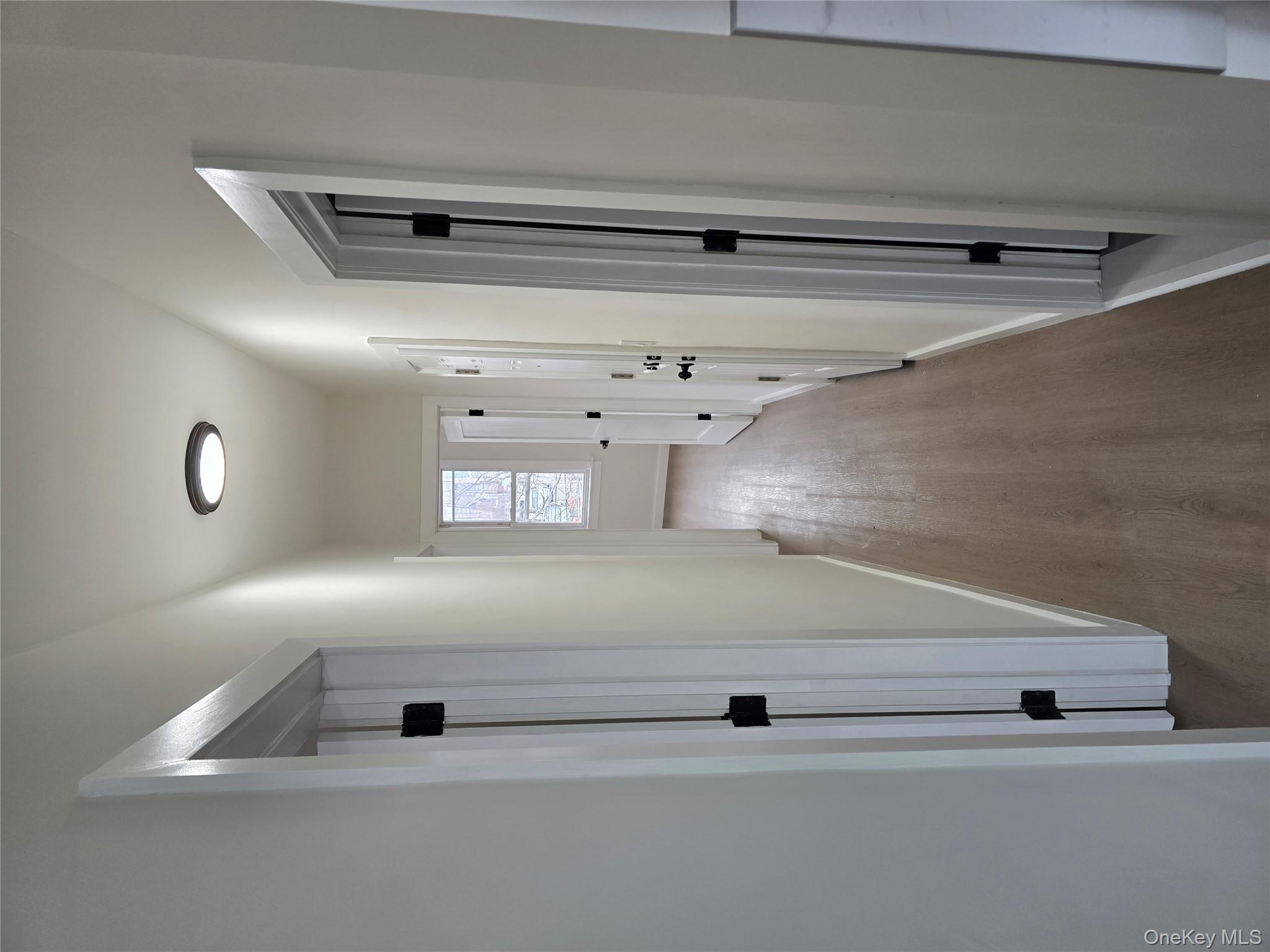112 Webster Avenue, Unit 3 New Rochelle, NY 10801 - Photo 7 of 7 a view of a hallway with wooden floor