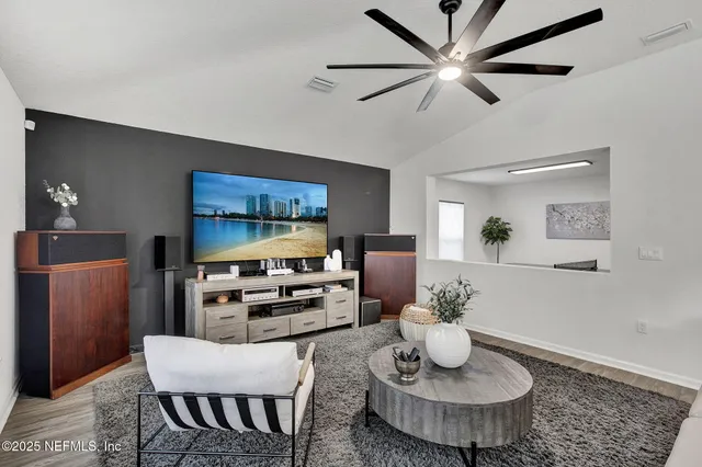 a living room with furniture and a table