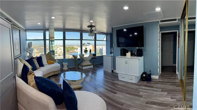 a living room with furniture and a large window