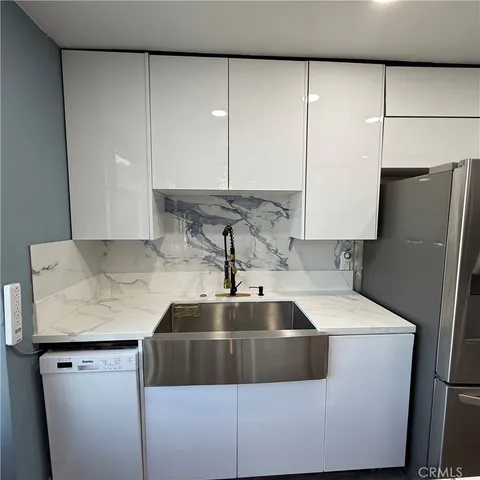 a kitchen with counter space view and appliances