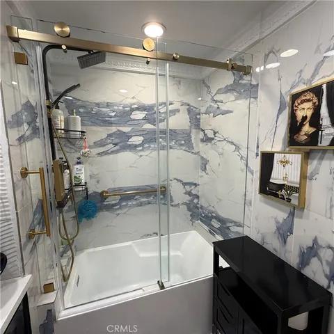 a bedroom with a bed and a lamp with window