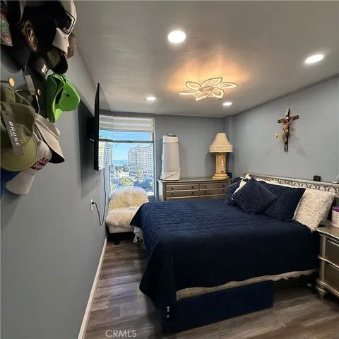 a bed room with bed and window