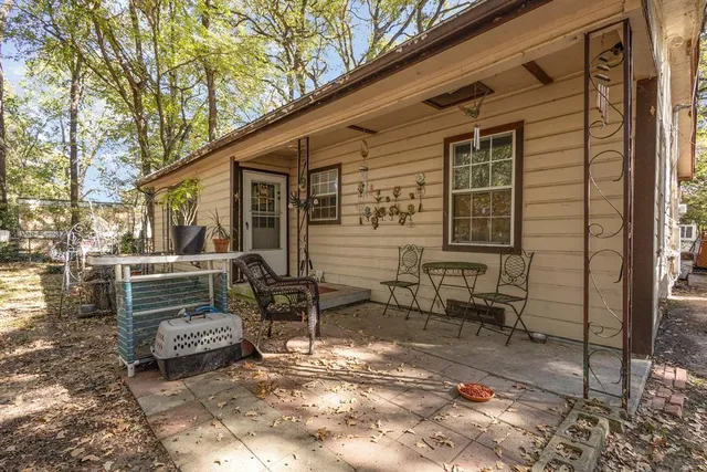 a backyard of a house with outdoor seating