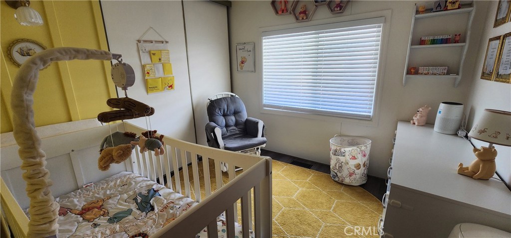 3589 West Wells Road, Unit 99 Blythe, CA 92225 - Photo 11 of 27 a view of a bedroom with furniture and a window