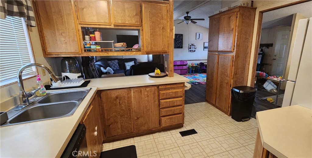 3589 West Wells Road, Unit 99 Blythe, CA 92225 - Photo 4 of 27 a kitchen with a sink and cabinets